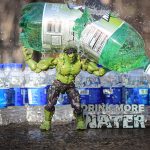 A toy Incredible Hulk smashes a 2 liter of soda while surrounded by many bottles of water.